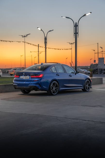 Blue sports car at sunset