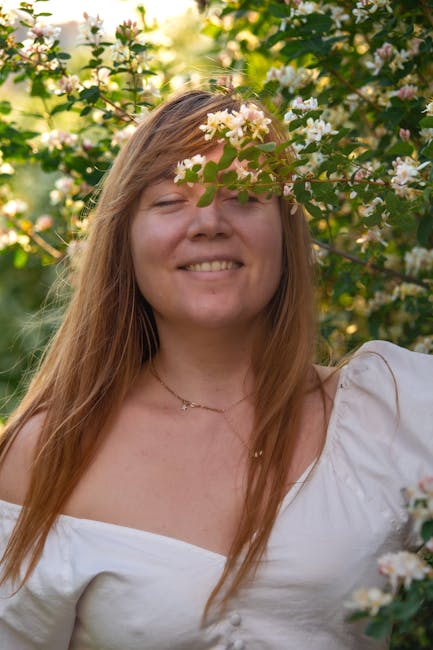 Woman meditating in natural sunlit garden